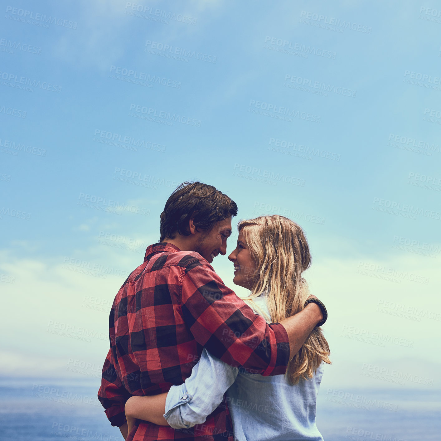 Buy stock photo Couple, blue sky and hug for love in nature, hug and embrace for married people with view. Adventure, travel and holiday for anniversary to Los Angeles, trust and support with smile for together