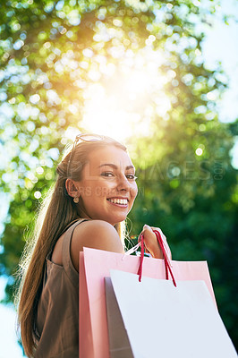 Buy stock photo Cropped portrait of an attractive young woman enjoying a day of shopping