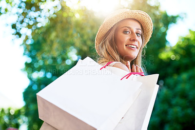 Buy stock photo Cropped portrait of an attractive young woman enjoying a day of shopping