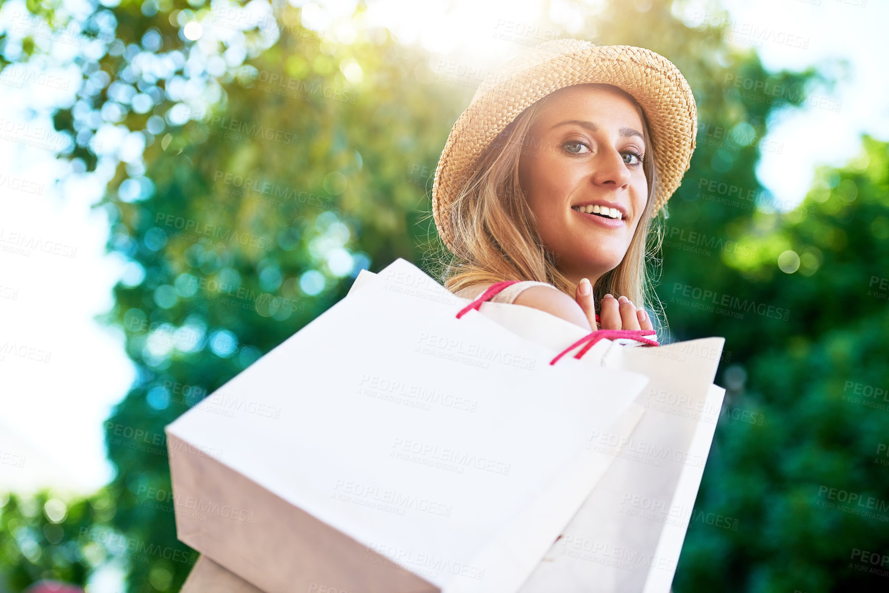 Buy stock photo Cropped portrait of an attractive young woman enjoying a day of shopping