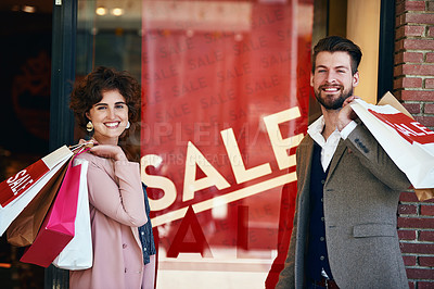 Buy stock photo Shot of a young couple out on a shopping spree
