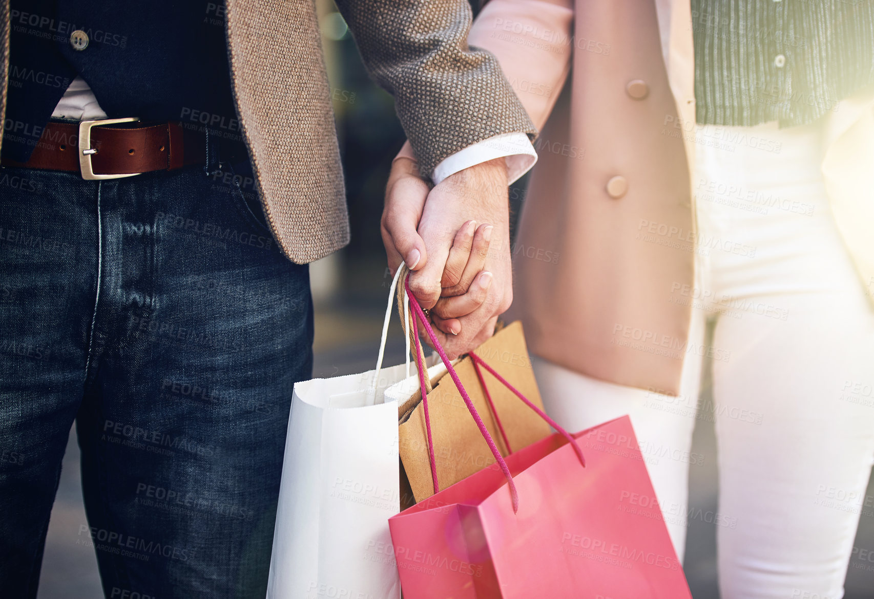 Buy stock photo Cropped shot of an affectionate couple out on a shopping spree