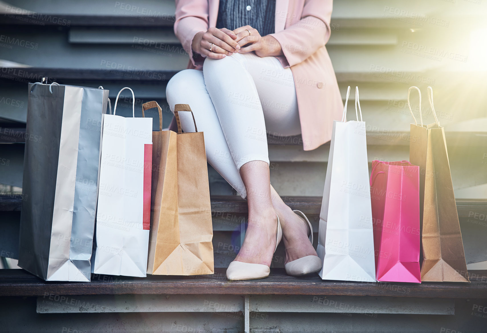 Buy stock photo Cropped shot of a young woman out on a shopping spree
