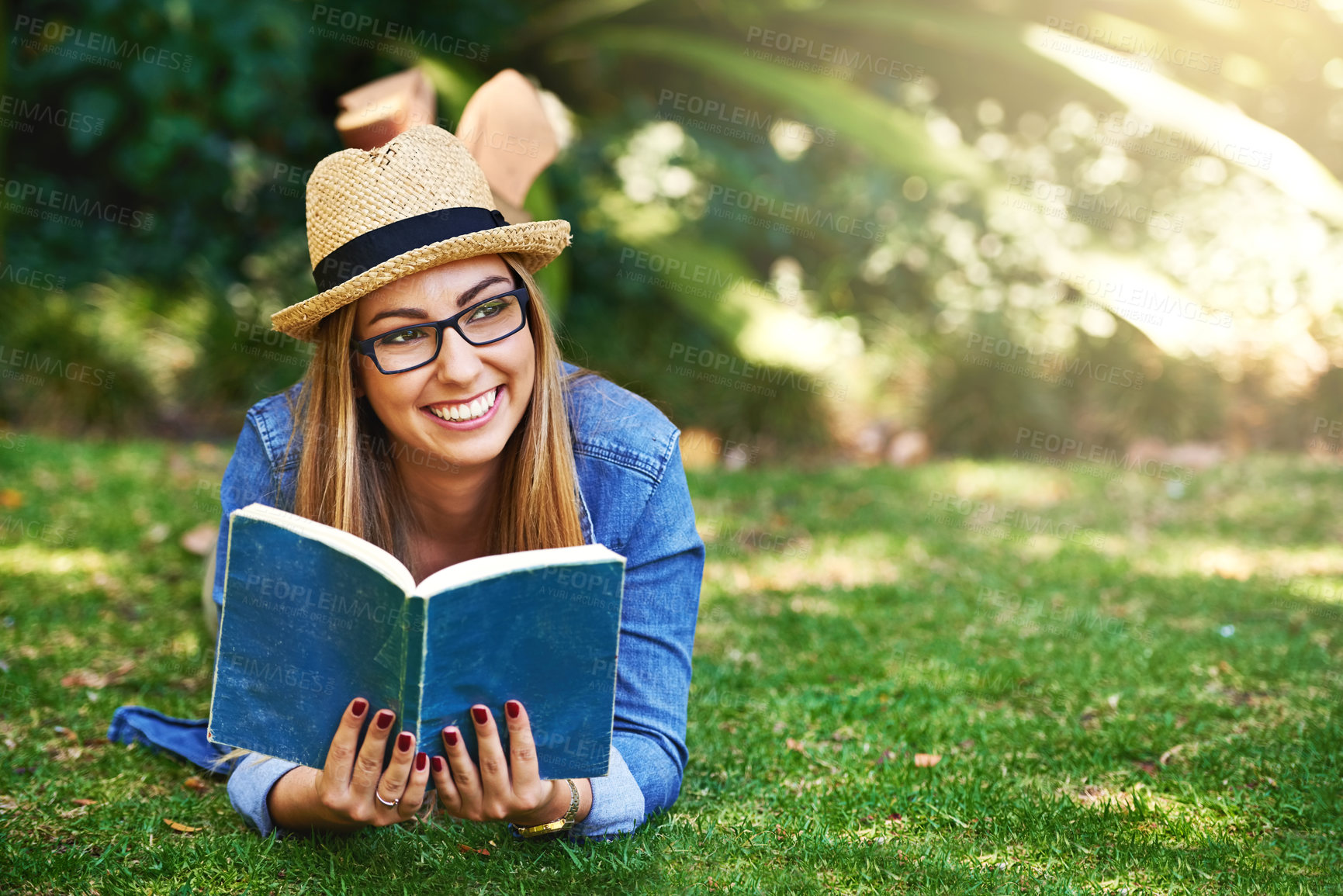Buy stock photo Nature, thinking and girl with book for reading, learning and knowledge with smile outdoor. Park, female student and novel for entertainment, fiction and English literature for language improvement