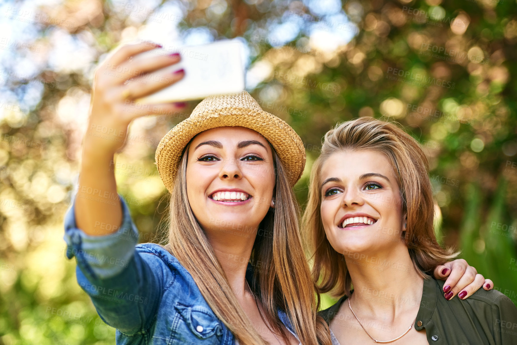 Buy stock photo Selfie, outdoor and women with smile, hug and friends with happiness, bonding together and social media. People, nature and girls in park, cellphone and adventure with memory, journey and connection