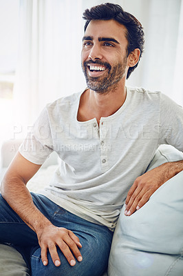 Buy stock photo Shot of a man relaxing on the sofa at home