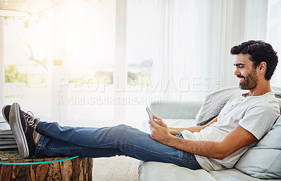 Buy stock photo Sofa, man and tablet in home or happy, scrolling and online for internet search and reading blog for streaming website. Email, social media and communication technology, comfort and weekend break