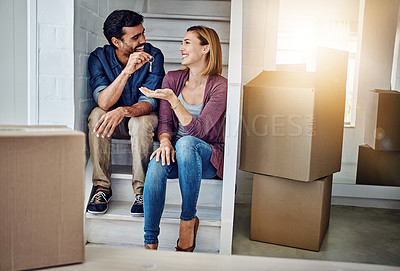 Buy stock photo Shot of a man handing his wife the keys of their new home