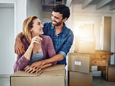 Buy stock photo Shot of a couple moving into their new home