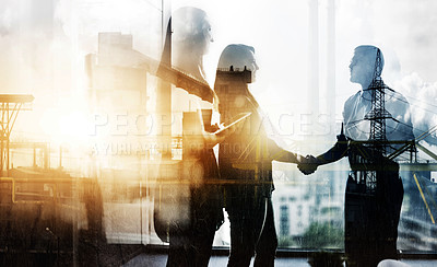 Buy stock photo Digitally enhanced shot of two businesspeople shaking hands in the office