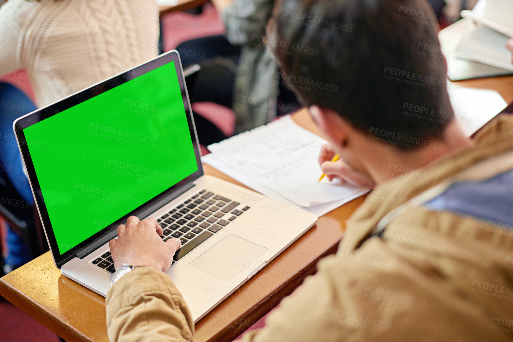 Buy stock photo Overhead shot of a student using his laptop at his desk in class