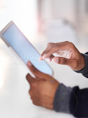Buy stock photo Cropped closeup shot of an unrecognizable man using a digital tablet