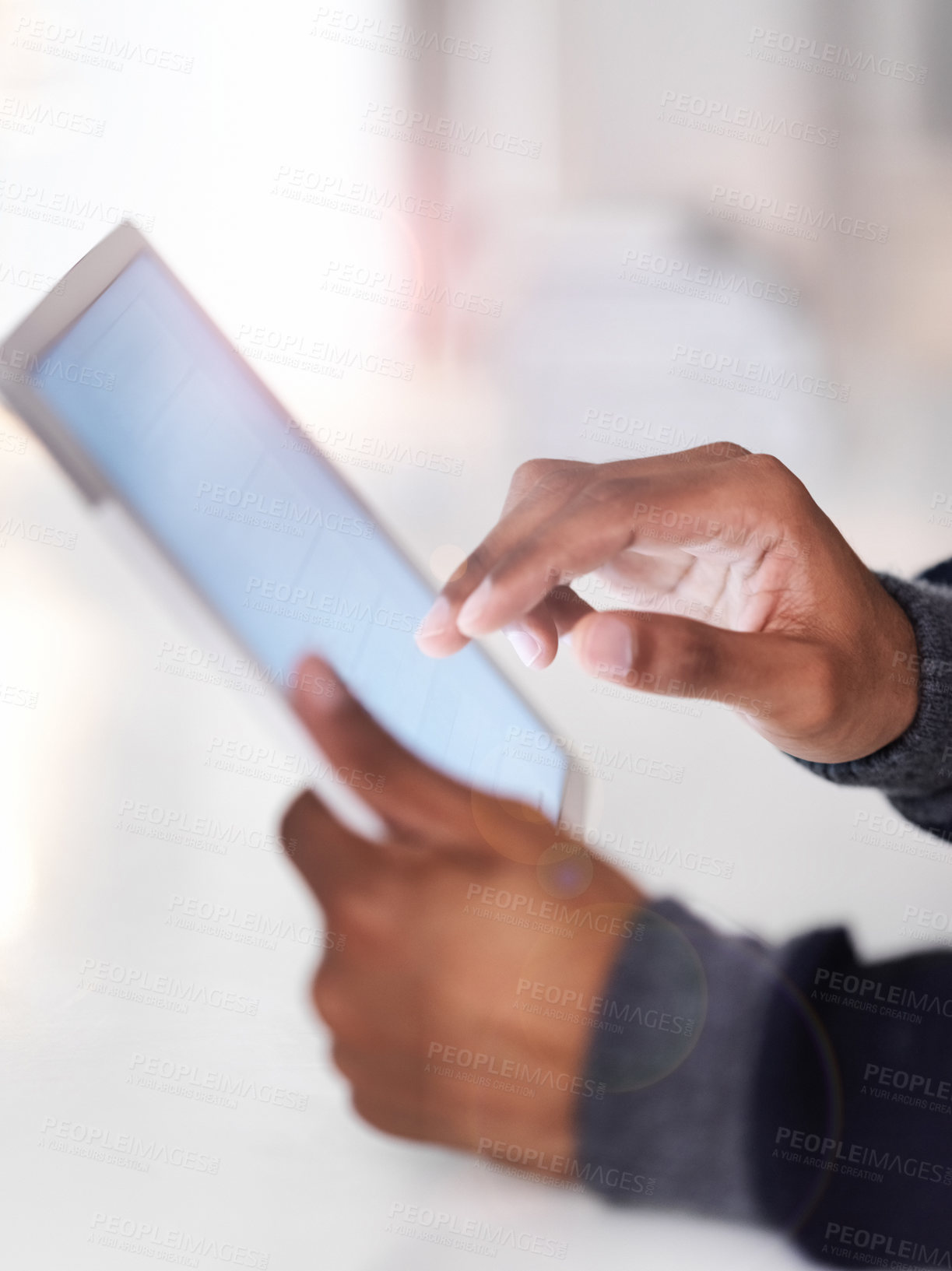 Buy stock photo Cropped closeup shot of an unrecognizable man using a digital tablet