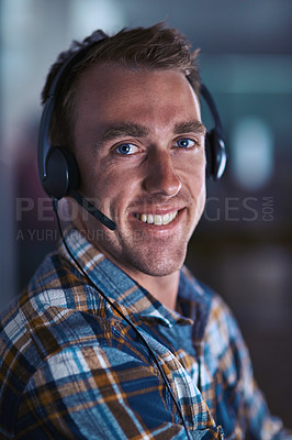 Buy stock photo Happy call center agent smiling, ready to help a client on a phone call with good customer service and support. Close up portrait of a contact support worker consulting at his desk via his headset