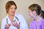 Explaining in a way her young patient can understand