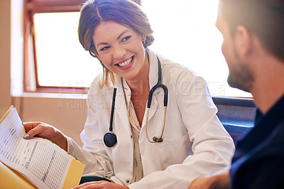 Buy stock photo Shot of a young doctor consulting with a patient in her office
