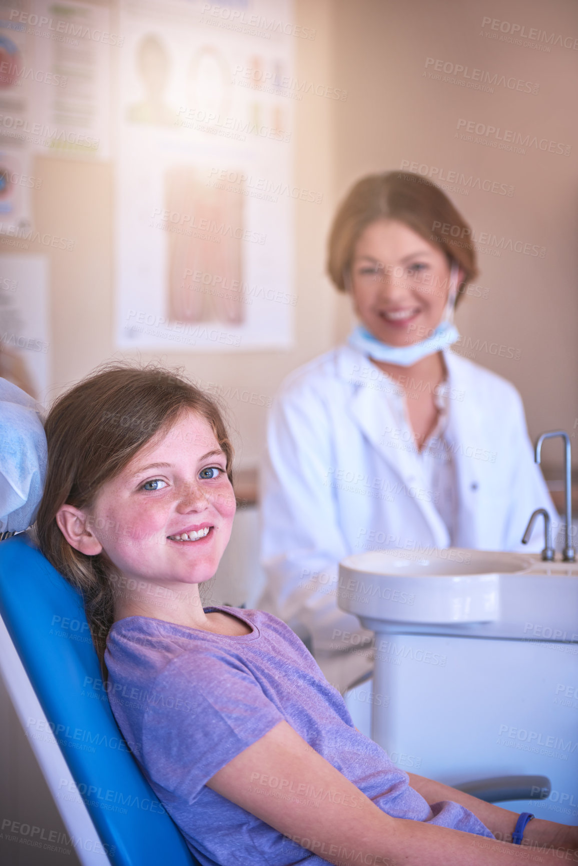 Buy stock photo Shot of a little girl at the dentist for a checkup