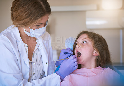 Buy stock photo Girl, woman dentist and dental checking with oral hygiene and teeth care with patient and mouth exam. Toothache, tooth cleaning and medical help with kid, doctor and dentistry tool for healthcare