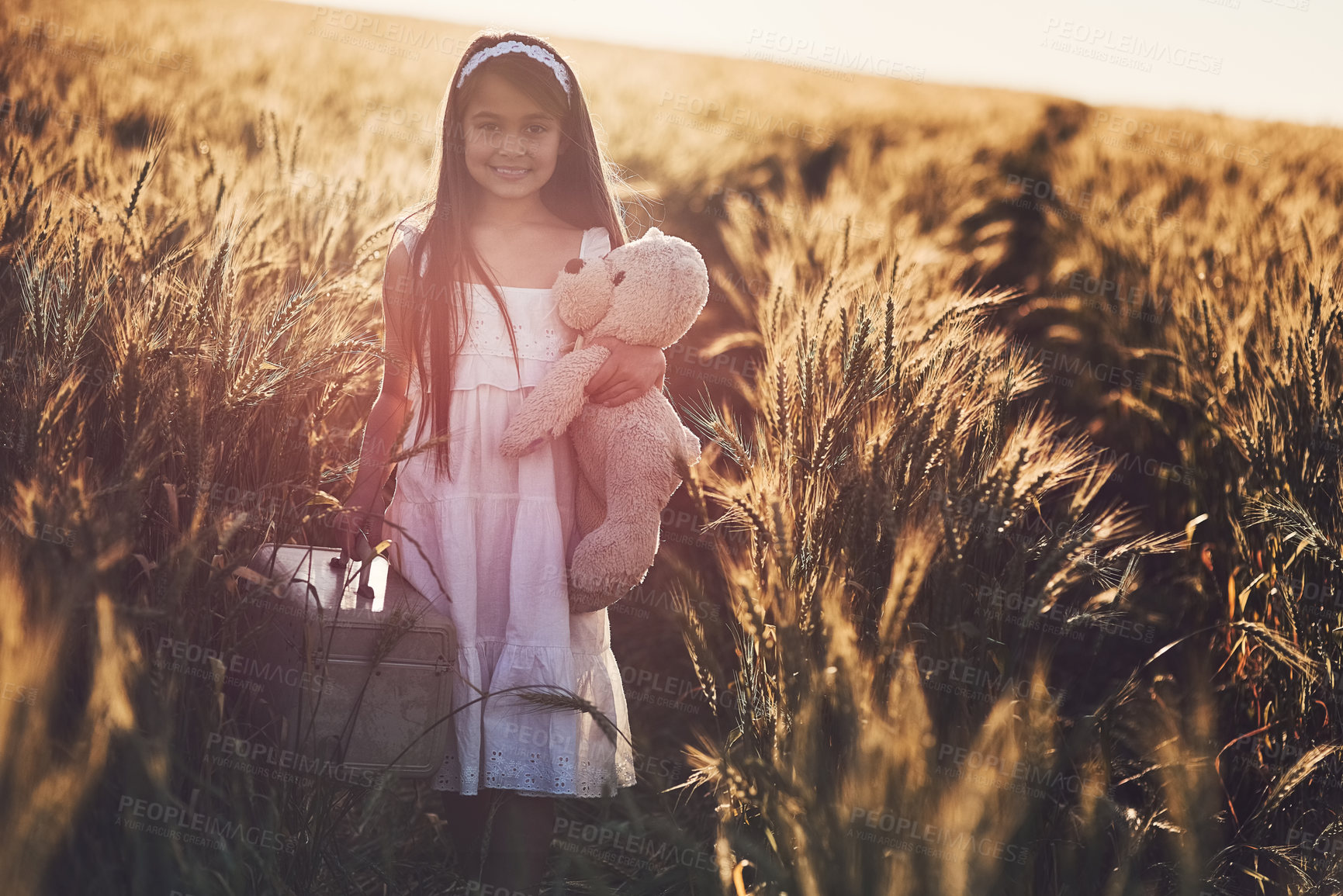 Buy stock photo Portrait, kid and teddy bear in field for play, fantasy and creativity or game in nature. Smile, toys and girl child in countryside for entertainment, learning or outdoor for growth or wellness 