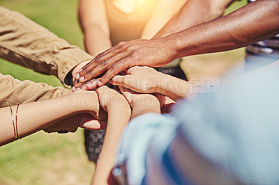 Buy stock photo Cropped shot of a group of friends with their hands piled on top of each other