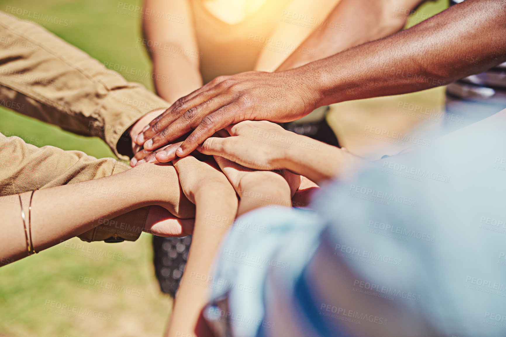 Buy stock photo Cropped shot of a group of friends with their hands piled on top of each other