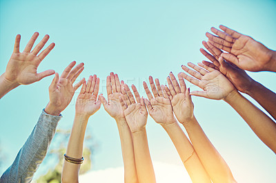 Buy stock photo Group of people, blue sky and hands on air for teamwork, partnership and support with motivation. Friendship, diversity and collaboration for equality, freedom and solidarity as community outdoor