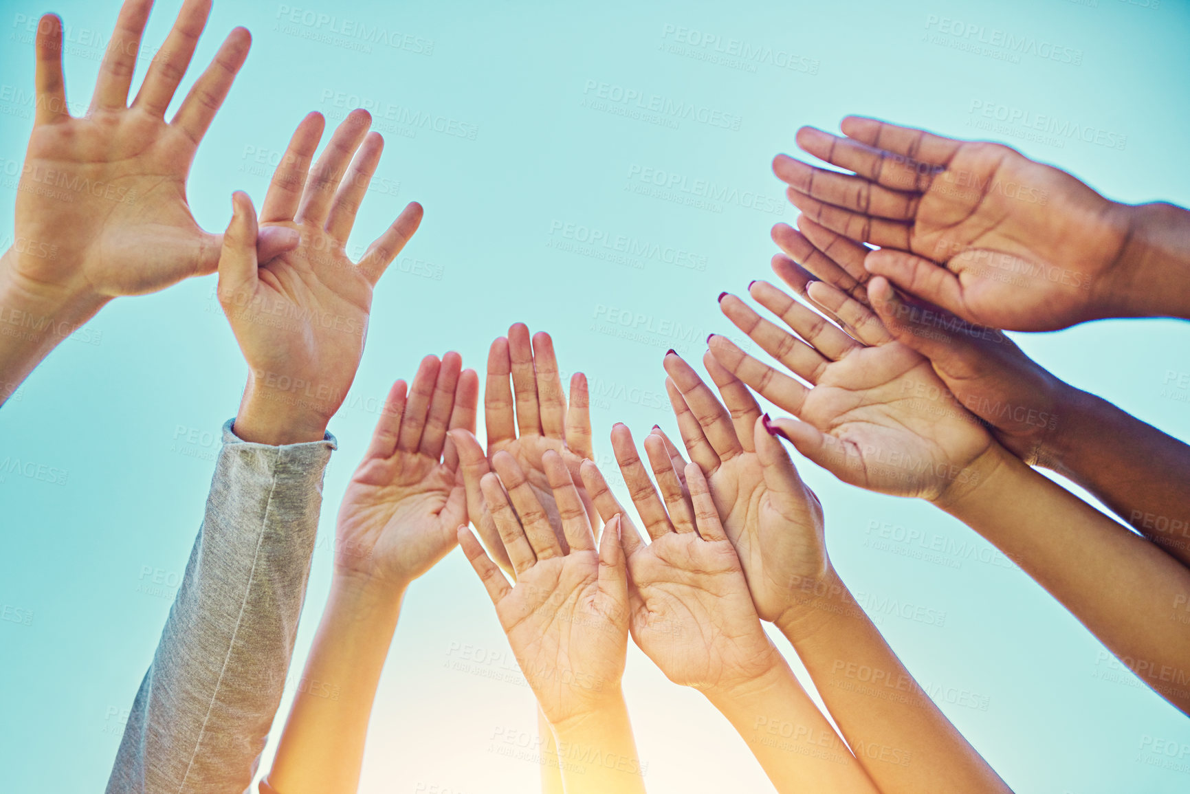 Buy stock photo Group of people, hands up and blue sky for teamwork, partnership and support with motivation. Friendship, diversity and collaboration for equality, freedom and solidarity as community outdoor