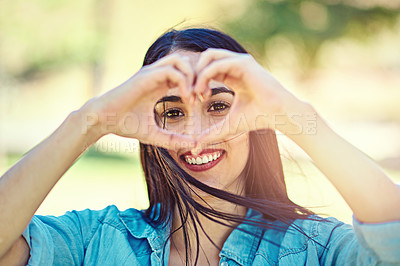 Buy stock photo Portrait, woman and heart shape in park with hands for freedom, support and kindness symbol. Outdoor, girl and love sign with smile in nature, wellness and peace with emoji gesture with happiness