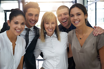 Buy stock photo Portrait of a group of confident young businesspeople standing together in an office