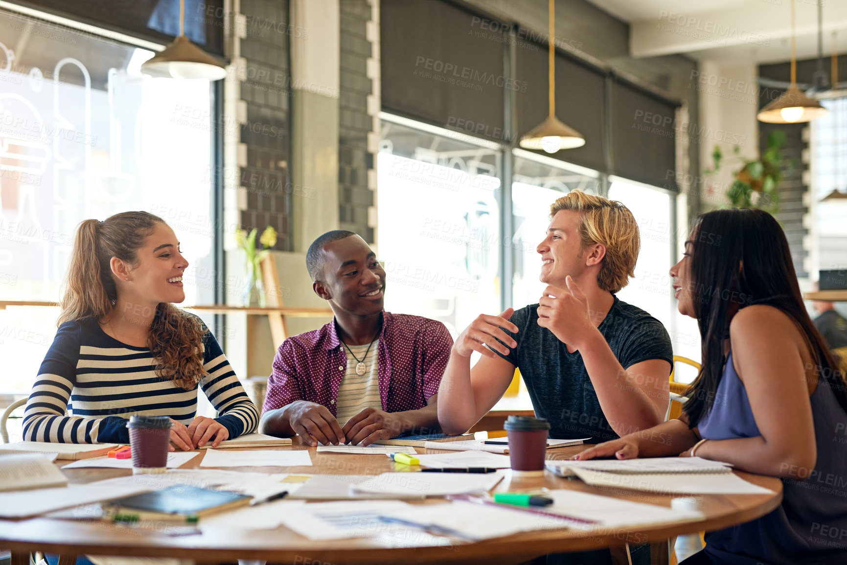 Buy stock photo Students, talking and university notes at cafe with group, education and exam study for learning. College research, restaurant and smile of young people with school project and paperwork for test