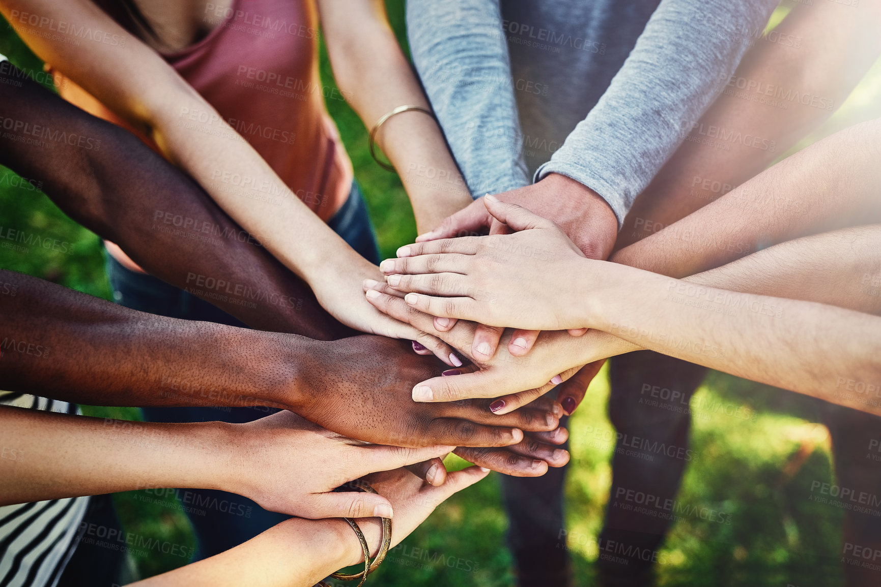 Buy stock photo Hands, diversity and friends at a park for teamwork, partnership and volunteering mission from above. Top view, people and hand support by volunteer group outdoor for community, charity and activism