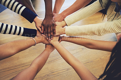 Buy stock photo Circle, group and hands stack with people, teamwork and support for motivation, trust or solidarity by desk. Team, helping hand and together with goal, community and friends with top view by table