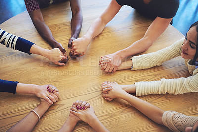 Buy stock photo Shot of a group of unidentifiable friends joining their hands in solidarity