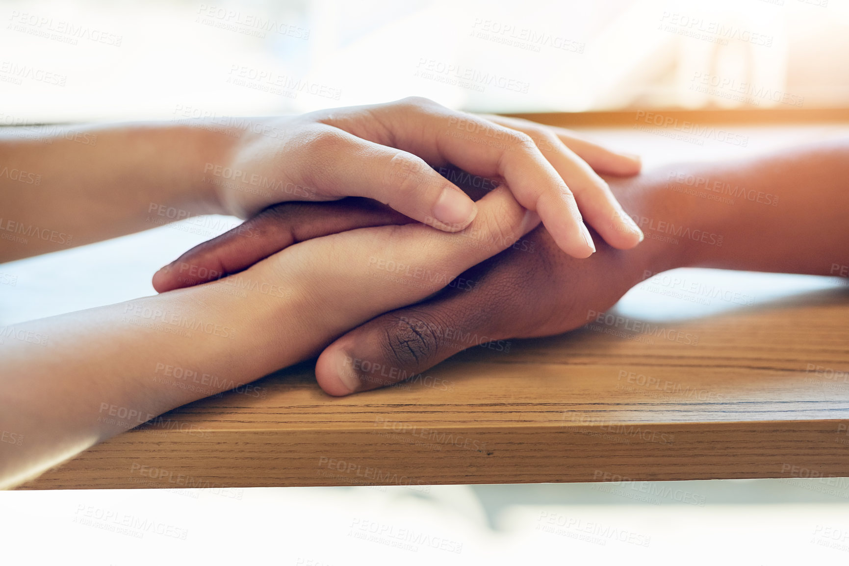 Buy stock photo Shot of an unidentifiable young woman holding a friend's hands in consolation