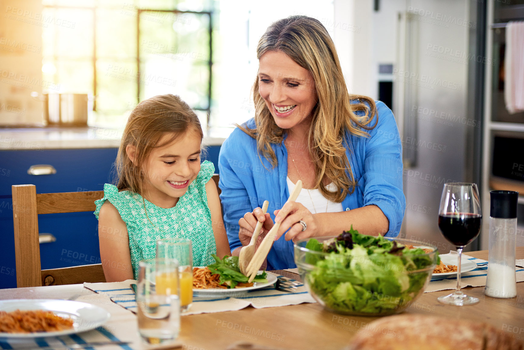 Buy stock photo Happy, food or mother and daughter in a house for lunch, conversation and bonding with organic meal. Salad, brunch or family at home with health, diet and nutrition on vacation, event or weekend