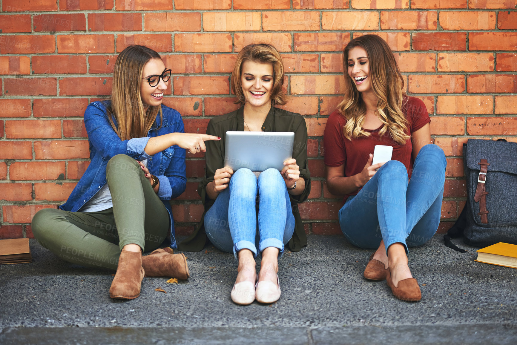 Buy stock photo University, students and friends on tablet and wall background for research, reading and collaboration on floor. Young people or girl with digital technology for e learning or social media in college