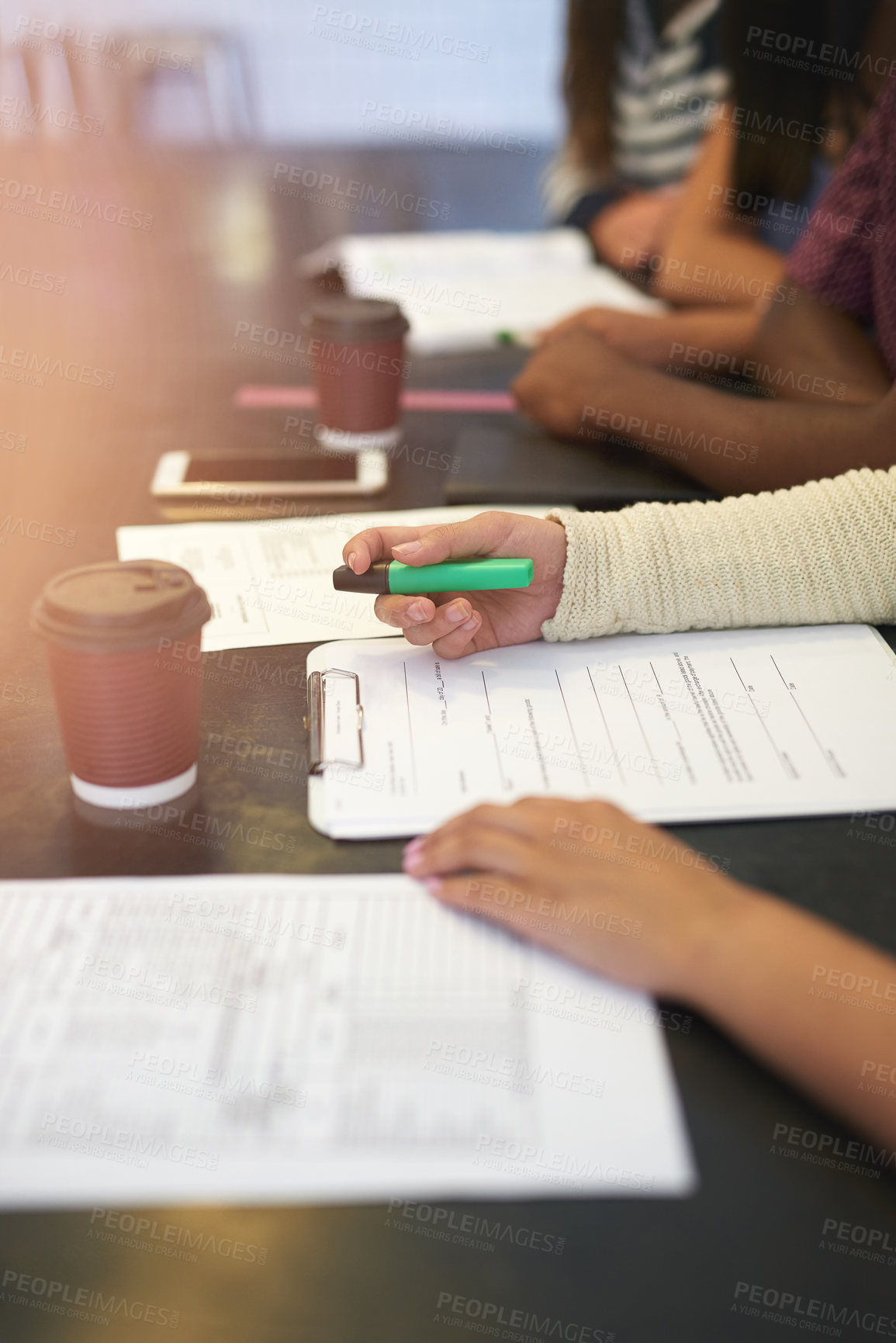 Buy stock photo Shot of a group of unidentifiable students having a study session in a cafe