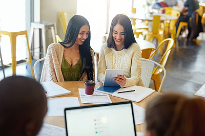 Buy stock photo Students, tablet and happy women at table for studying, research and session in cafeteria. Study group, paper notes and learning together in college for education, progress and knowledge for exams