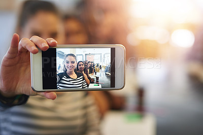 Buy stock photo Shot of a group of college students posing for a selfie together in a cafe