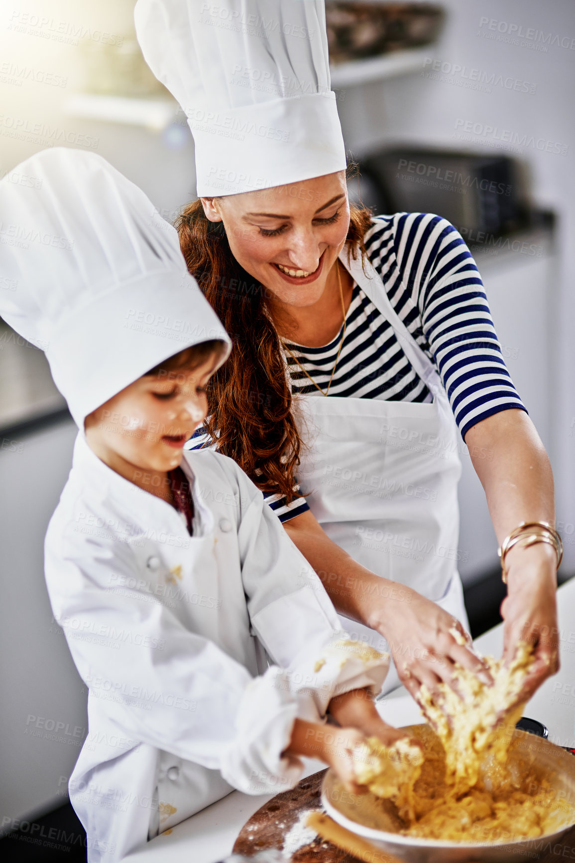 Buy stock photo Kitchen, playful woman and dirty boy, baking and learning with dough, prepare ingredients or culinary skills. Mother, home and kid for joy, cooking and fun development for recipe or breakfast help