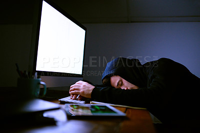 Buy stock photo Shot of an exhausted computer programmer sleeping at his desk at night