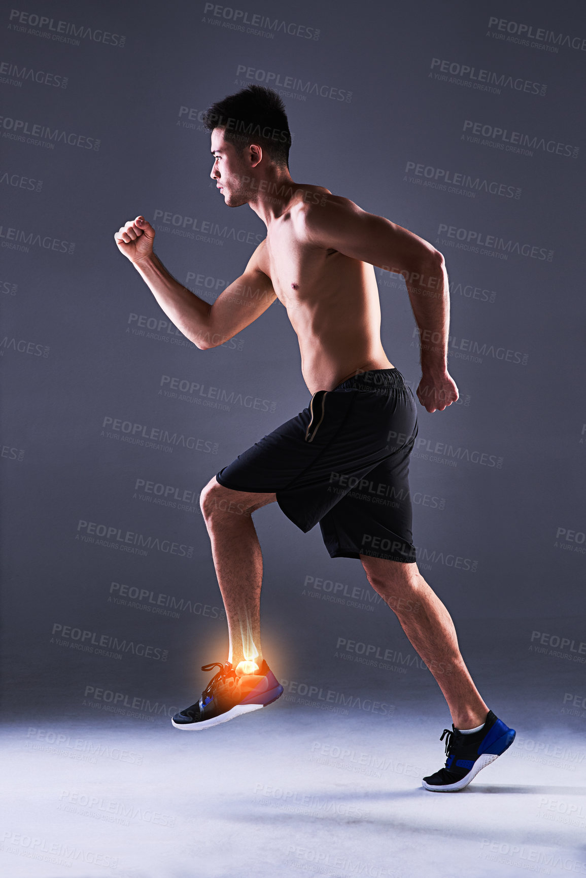 Buy stock photo Man, ankle and injury of fitness in studio, anatomy of leg or foot and xray for diagnosis. Red glow, running and person with inflammation of muscle strain, tension or ache and gray background.