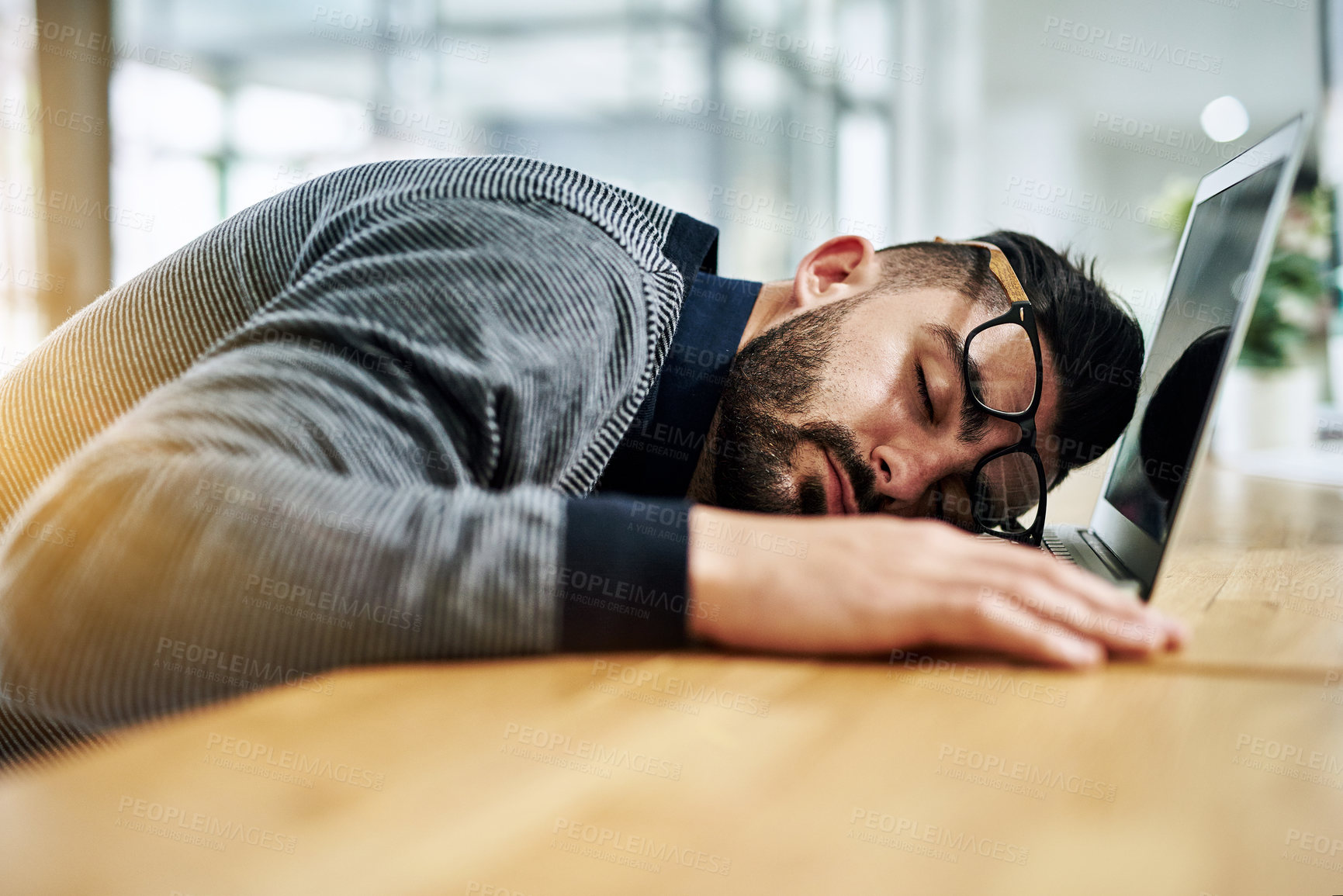 Buy stock photo Businessman, sleeping and tired with laptop by desk for burnout, exhausted or low energy by workspace. Corporate, employee and glasses with nap in office for work deadline or overwhelmed with project