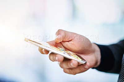 Buy stock photo Closeup shot of an unidentifiable man texting on a cellphone