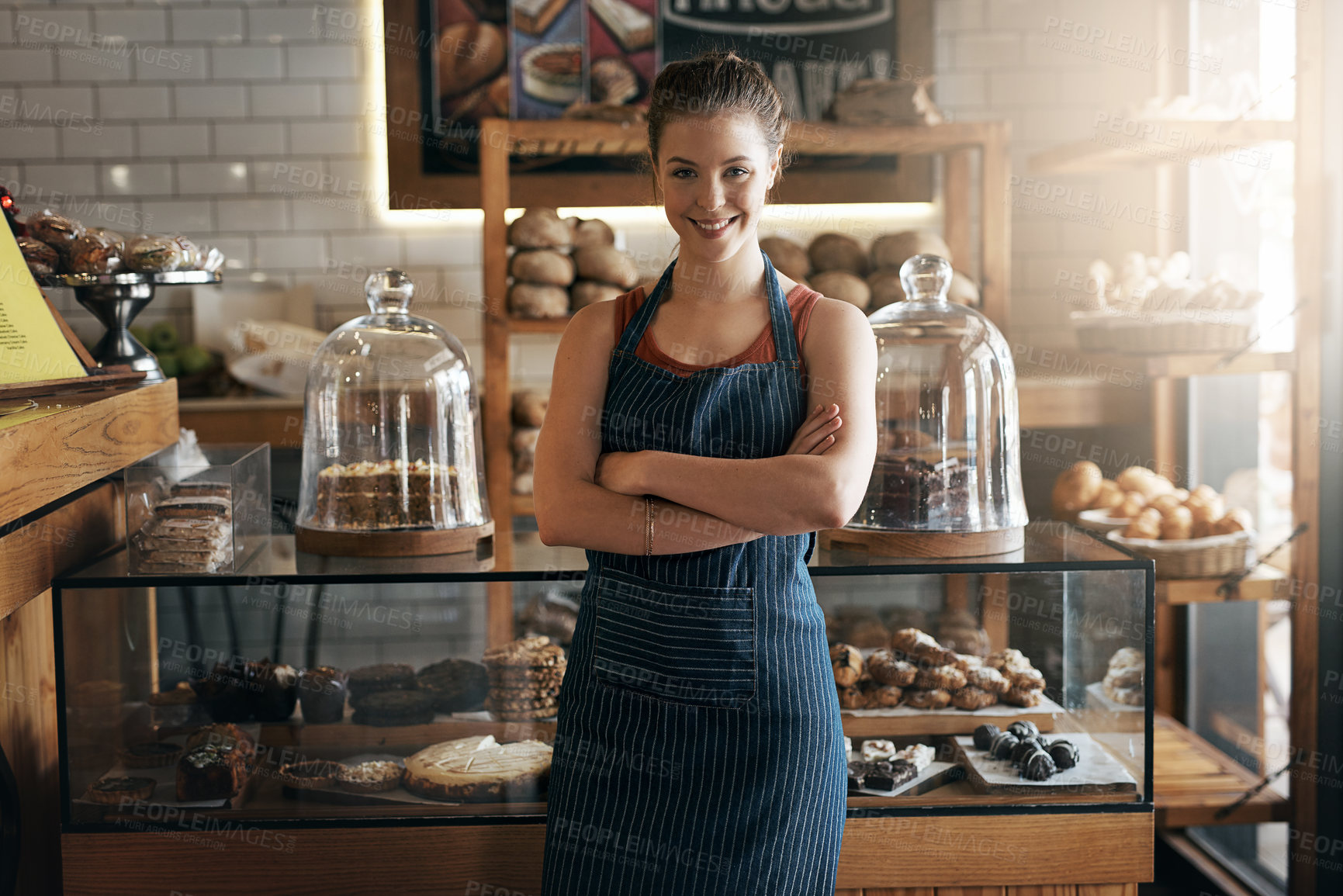 Buy stock photo Portrait of a confident young woman working in a coffee shop