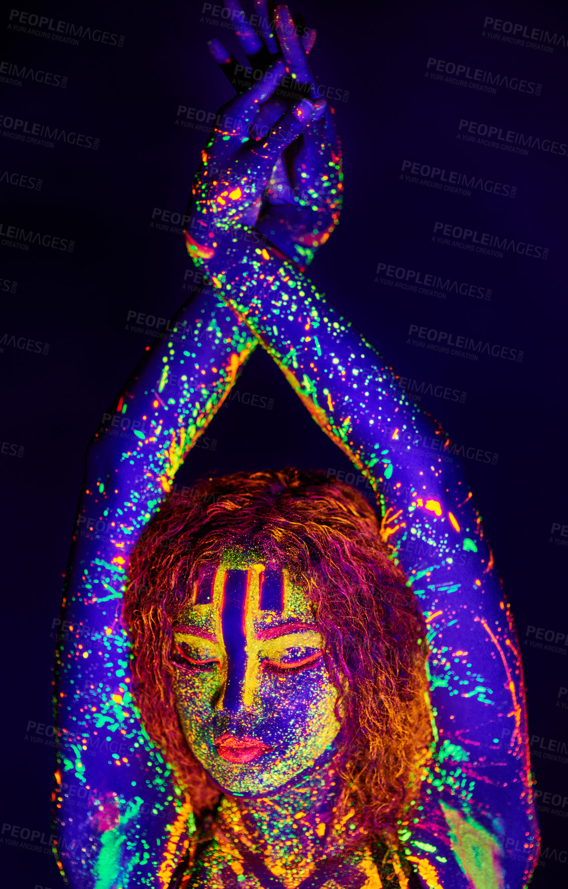Buy stock photo Cropped shot of a young woman posing with neon paint on her face
