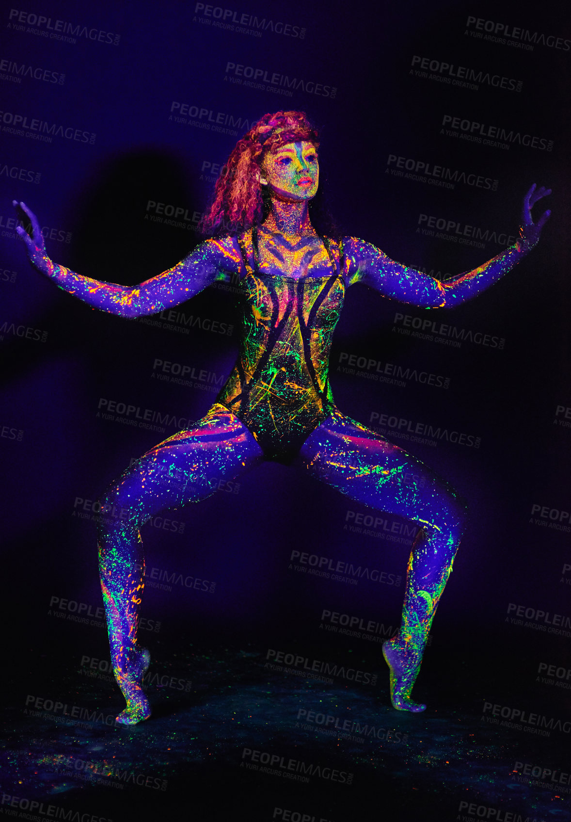 Buy stock photo Full length shot of a young woman posing with neon paint on her face
