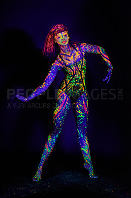 Buy stock photo Full length shot of a young woman posing with neon paint on her face
