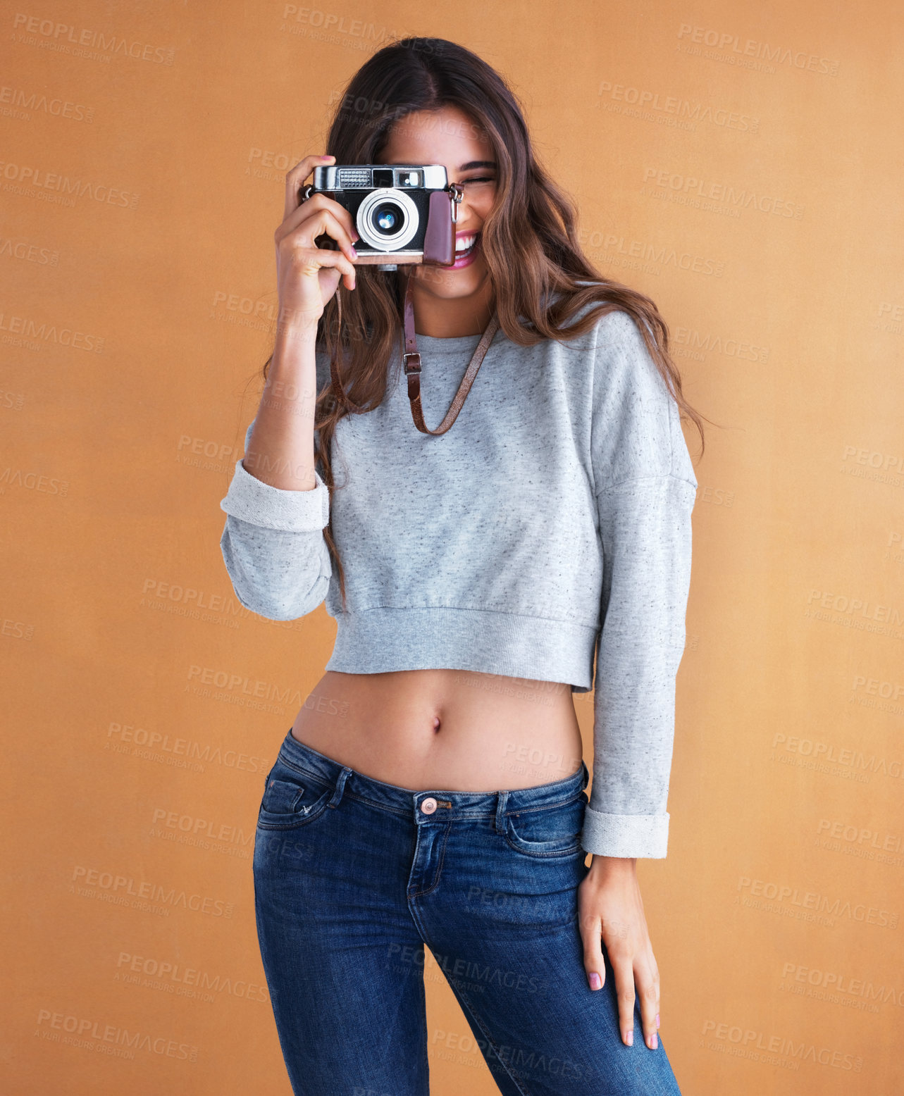 Buy stock photo Happy, girl and camera with retro, lens and photography in studio with smile. Gen z, vintage and excited with photo and creative college student with photographer and laugh with colorful background