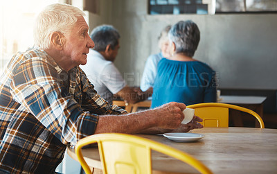 Buy stock photo Shot of a man sitting in a coffee shop